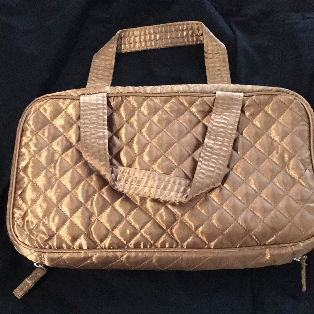 Glam gold quilted makeup/travel bag. Never used.